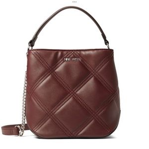 New with tags!  Nine West Sykes Bucket Crossbody purse.  Color - Merlot.